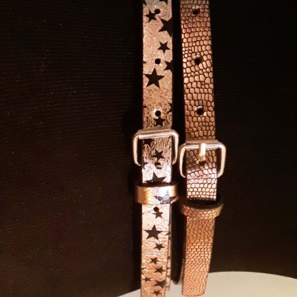 Two gold kids belts